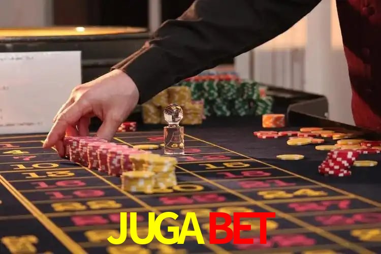 Una escena digital vívida inspirada en casino con JUGABET mostrado prominentemente, luces brillantes, fichas, cartas y acentos dorados.